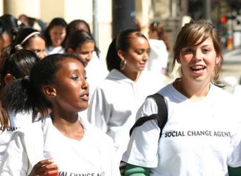 Smiling girls walking together outside